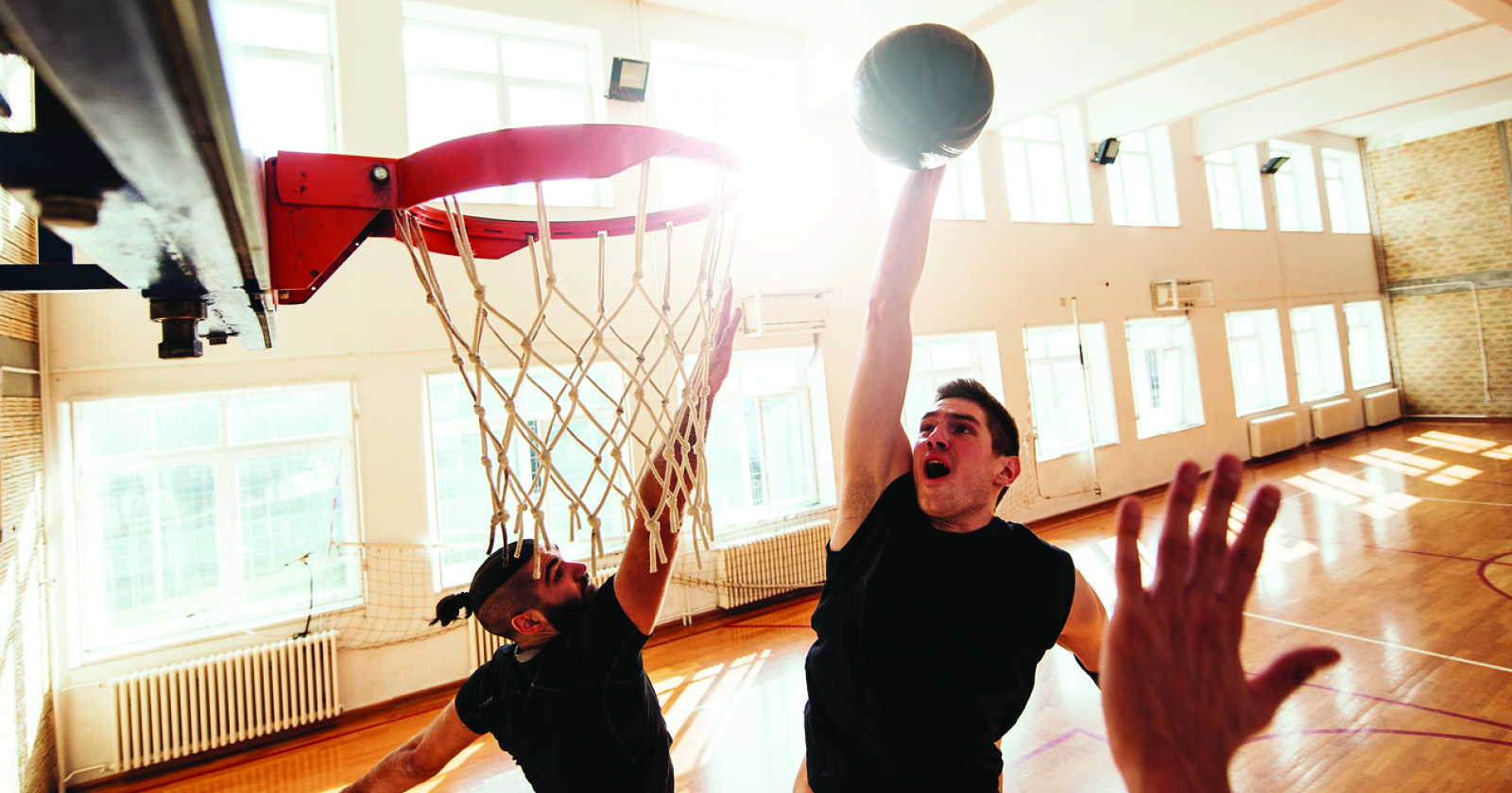 Men playing basketball at the YMCA