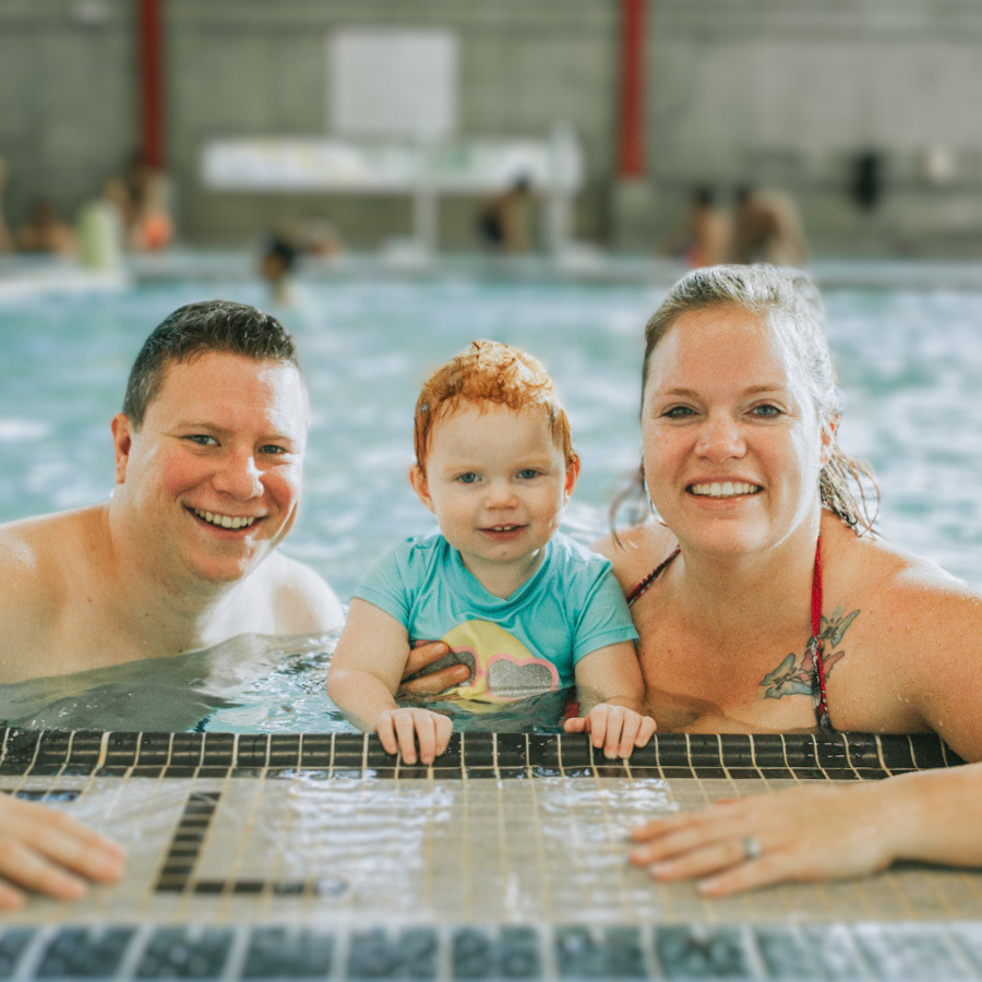 Family with baby at the pool