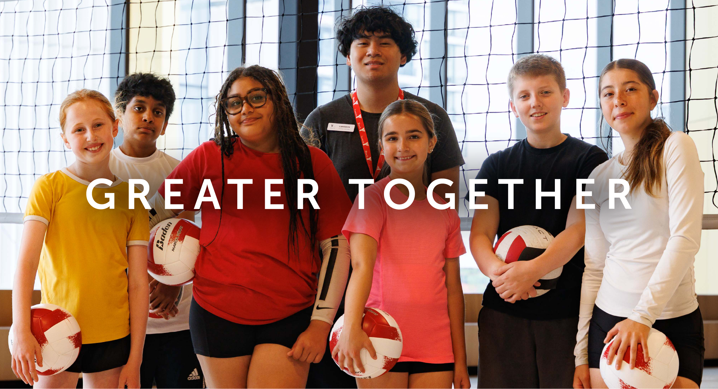 A group of youth at their local YMCA in the gym with a program leader